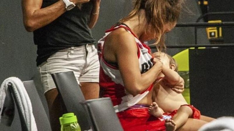 Viral photo of a basketball player breastfeeding his baby during a game